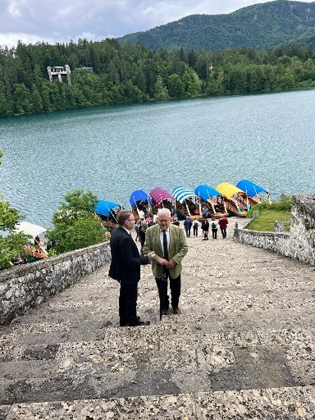 IOI President, Chris Field PSM, and former Mayor of the Lake Bled region, in front of Lake Bled.